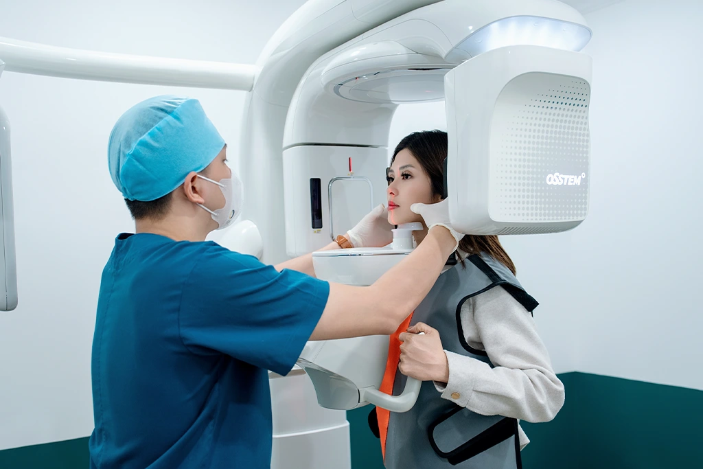 Dentist consulting a patient and examining oral health for a porcelain crown procedure