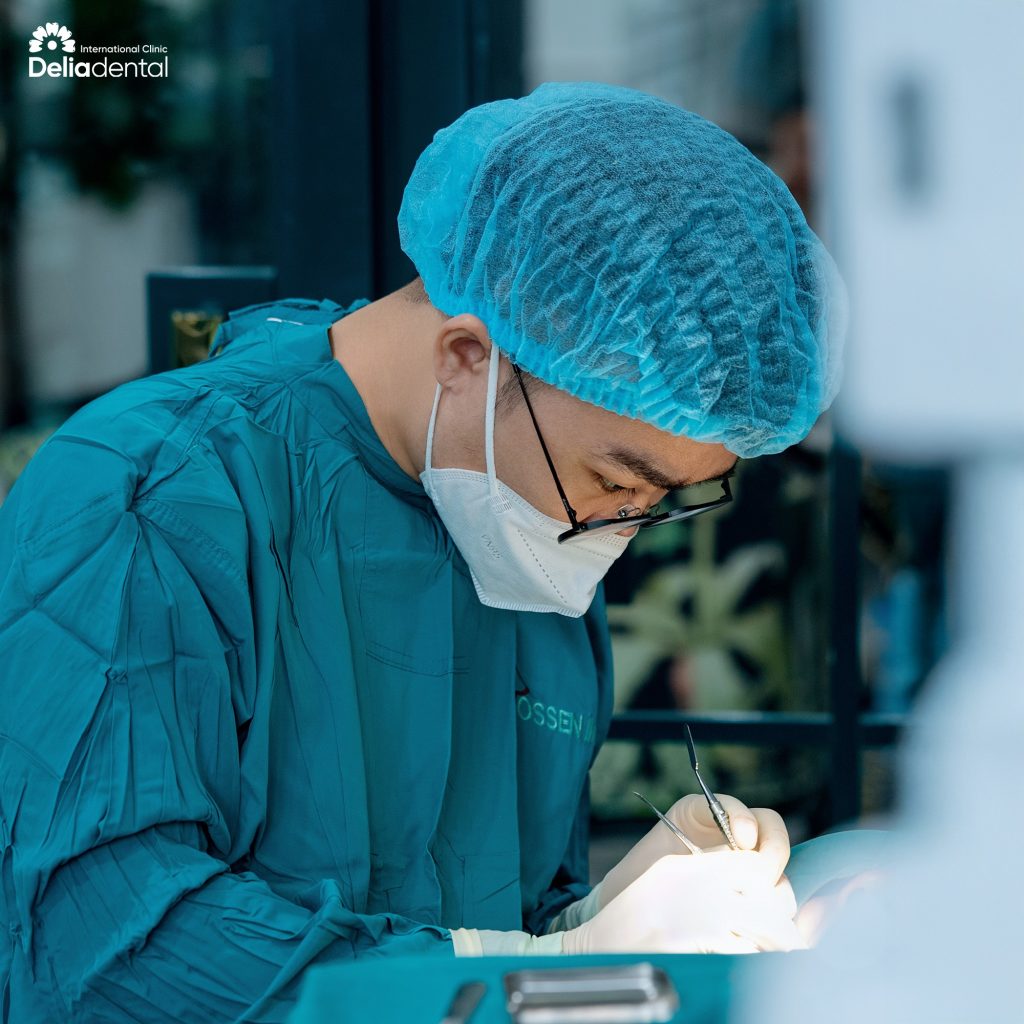 A specialist carefully placing dental implants in Vietnam under strict international safety standards.